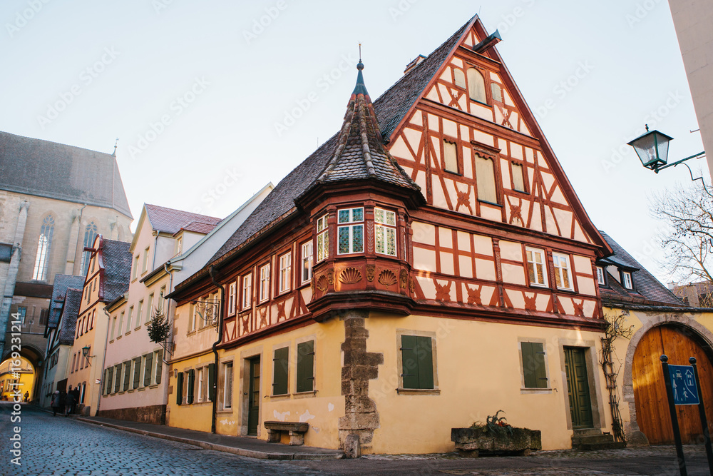 A beautiful street with a traditional German house in Rothenburg ob der Tauber in Germany. European city.