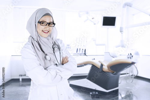 Confident Muslim doctor in the dental clinic