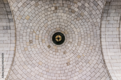 Tiled dome ceiling architecture with symmetrical details looking up