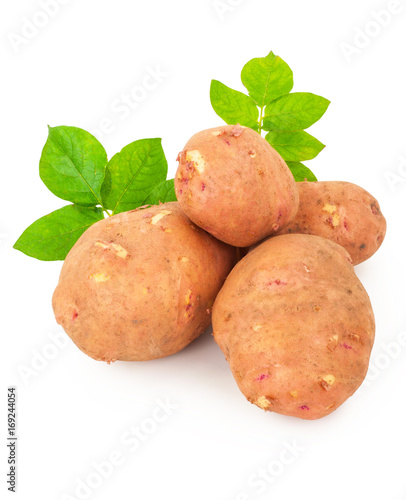 Red potatoes with leaves on a white