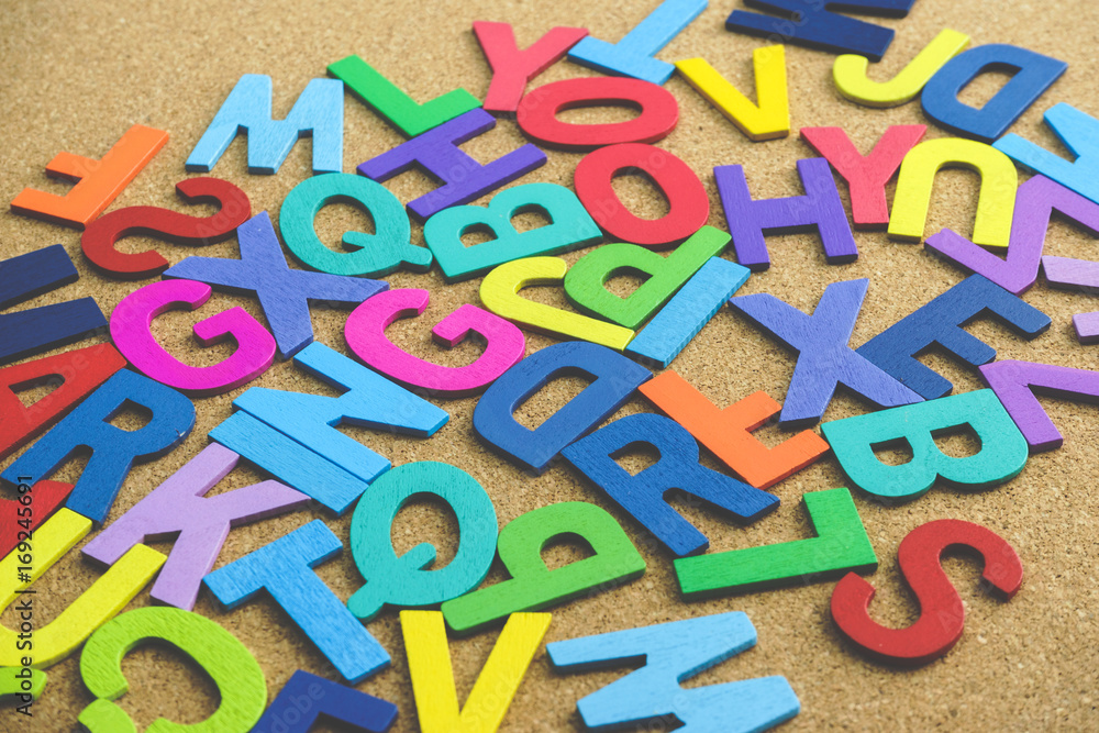 Colorful Wooden Alphabet Word  on wooden background