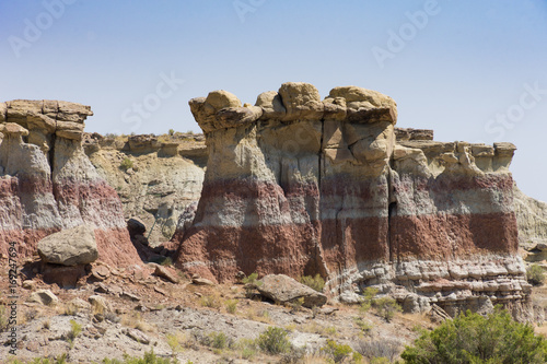 Gooseberry Creek Badlands Hoodoos made by wind and water erosion in the canyon. Colorful rock bands are seen on the canyon wall.