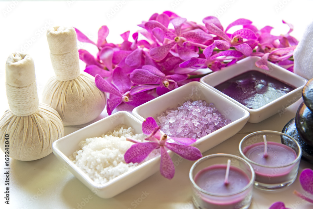 Thai Spa Treatments aroma therapy salt and sugar scrub and rock massage with orchid flower on wooden white. Healthy Concept. copy space,select and soft focus Thai Spa Treatments aroma therapy salt and sugar scrub and rock massage with orchid flower on wooden white. Healthy Concept. copy space,select and soft focus