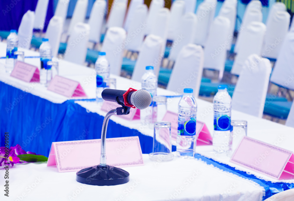 Fototapeta premium microphone wireless on stand table in conference seminar room with copy space add text :Select focus with shallow depth of field.