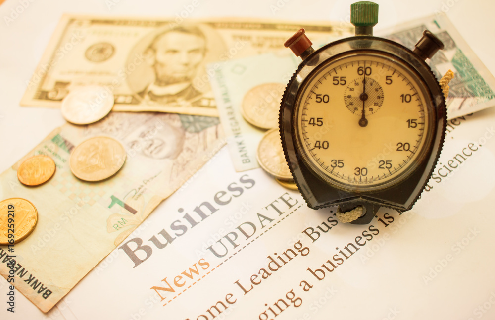 Time is money, Analog Clock on Dollars bills, Singapore banknotes and papers letter, Business News Update, Concept of Financial times for saving moneys for future, old tone Time is money, Analog Clock on Dollars bills, Singapore banknotes and papers letter, Business News Update, Concept of Financial times for saving moneys for future, old tone