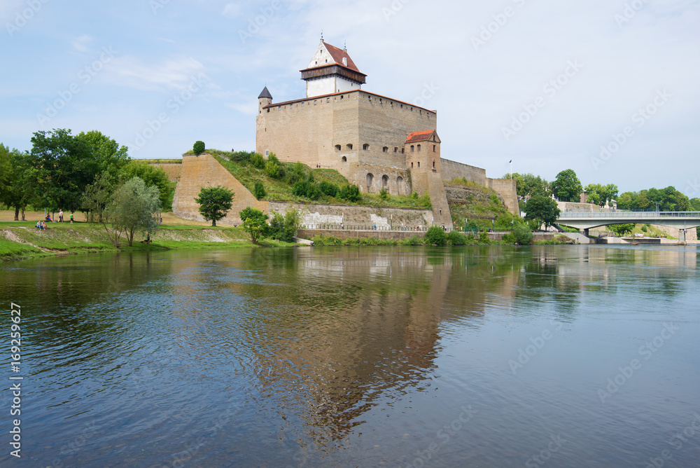 Herman's Castle over the Narva river  on the August day. Narva, Estonia