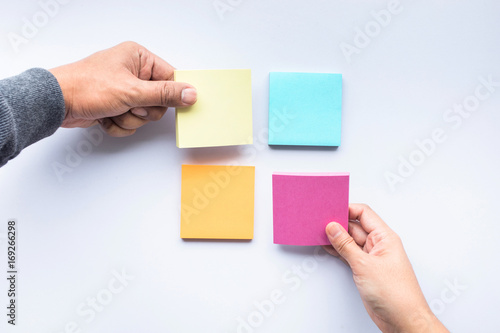 Male and female hand with notepaper color background.business brainstorming  and creativity idea concept