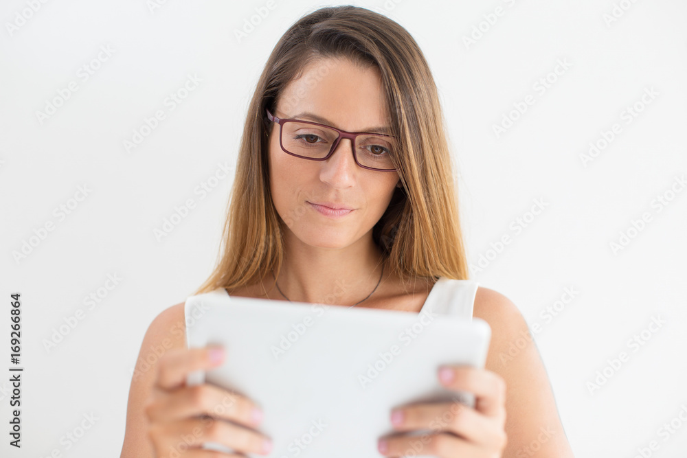 Serious businesswoman or student using touchpad Serious businesswoman or student using touchpad