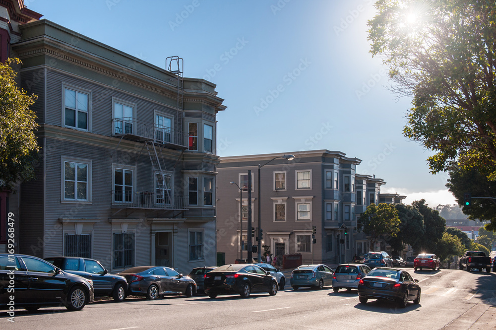 City traffic in San Francisco near the residential buildings in San Francisco California USA