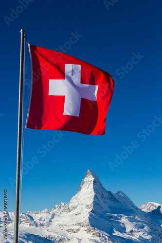Swiss Flag in front of the Matterhorn in Switzerland