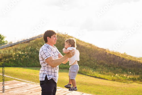 Happy father and son portrait playing together having fun