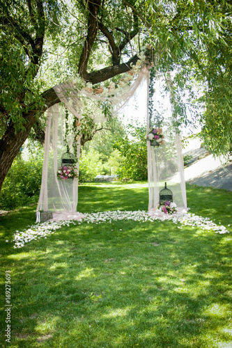 Wedding decor, decor in the trees, flowers in black cages