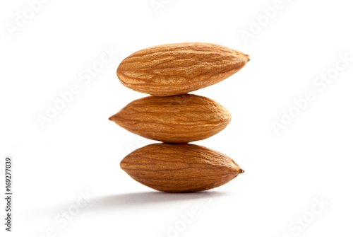 tower of almonds isolated on white
