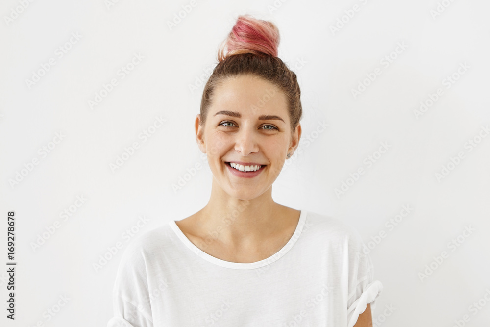Human emotions, feelings, attitude and reaction. Picture of fashionable female student with sincere joyful smile and charming blue eyes enjoying free time at home after lectures at university Human emotions, feelings, attitude and reaction. Picture of fashionable female student with sincere joyful smile and charming blue eyes enjoying free time at home after lectures at university