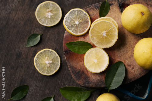 Fresh lemons on wooden background.