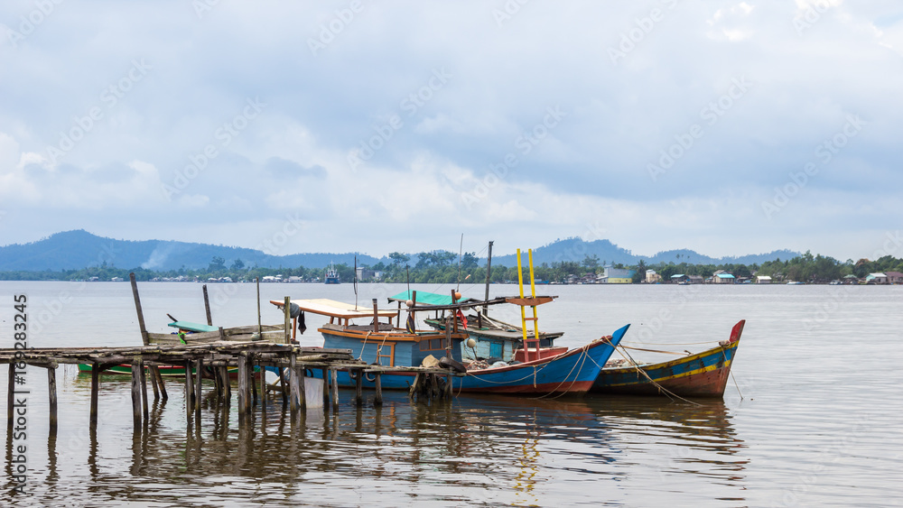 fishing boats in village indonesia kalimantan borneo