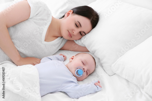 Young woman with cute baby ...