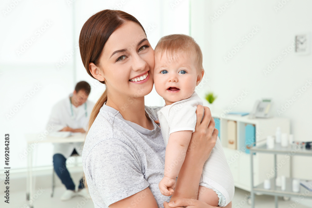 Young mother and baby girl in doctor's office Young mother and baby girl in doctor's office