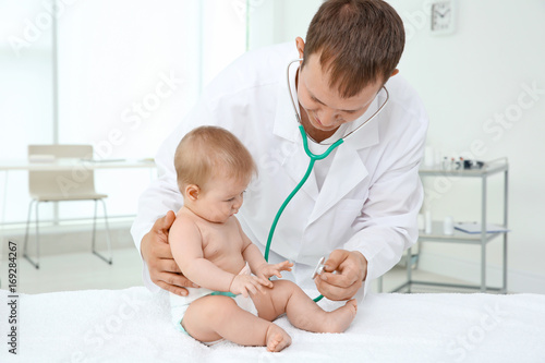 Doctor examining baby patient with stethoscope