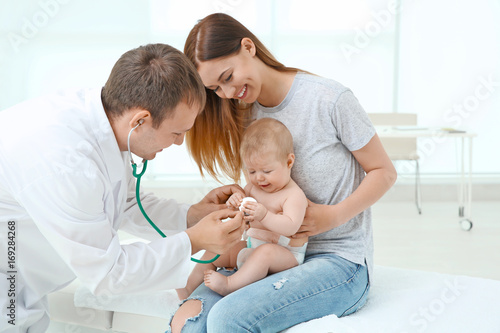 Doctor examining baby patient with stethoscope