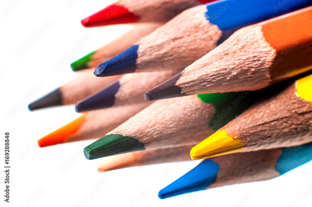Colored pencils on a white background, macro Colored pencils on a white background, macro
