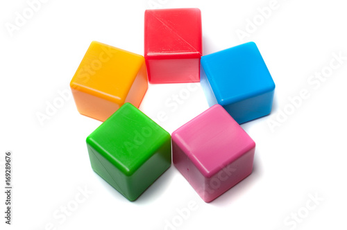 Colorful toy cubes on a white background