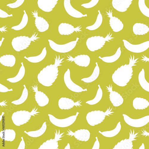 Seamless pattern with silhouettes of tropical fruits.
