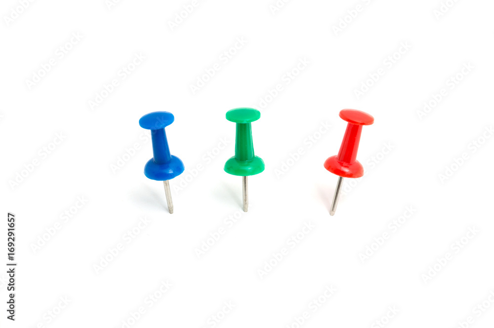 Three color push pin and on isolated white background Three color push pin and on isolated white background
