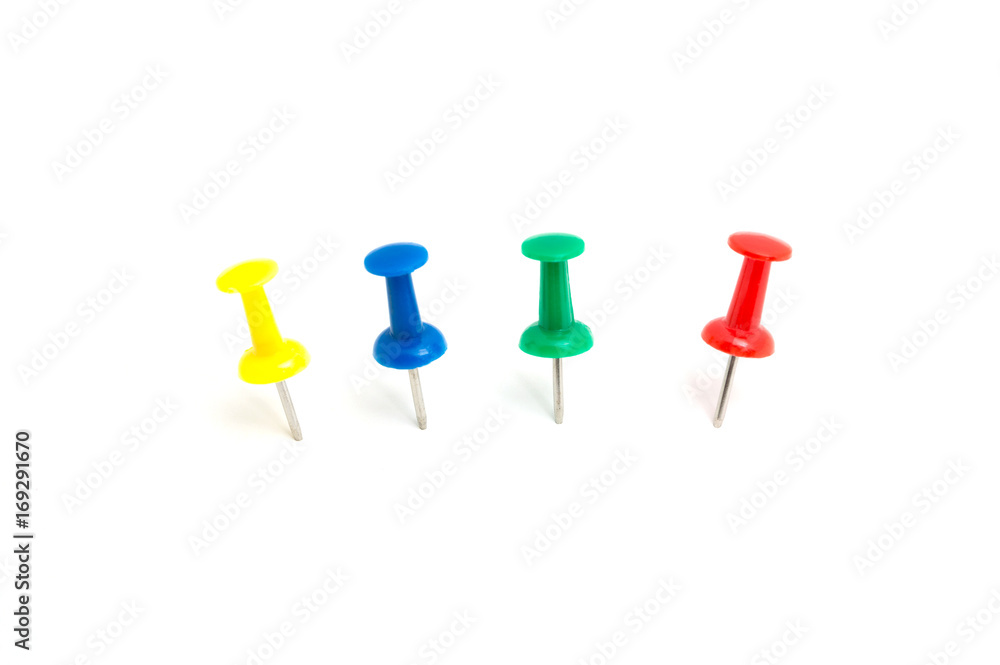 Four color push pin and on isolated white background Four color push pin and on isolated white background
