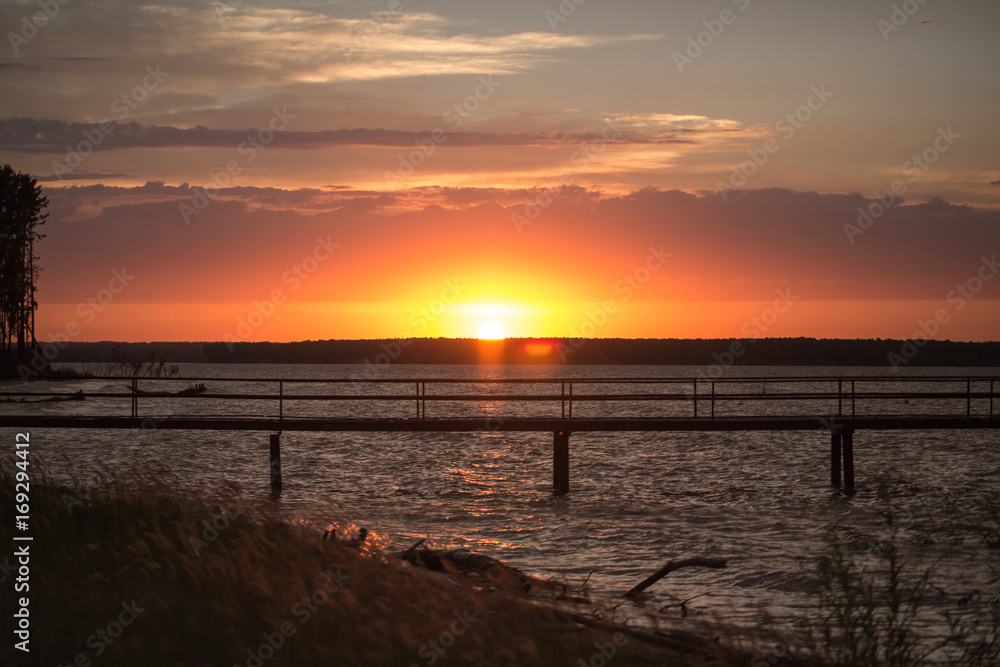 Fototapeta premium Wooden pier at sunset