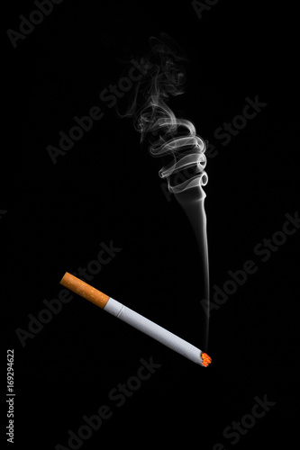 A smoking cigarette on a black background