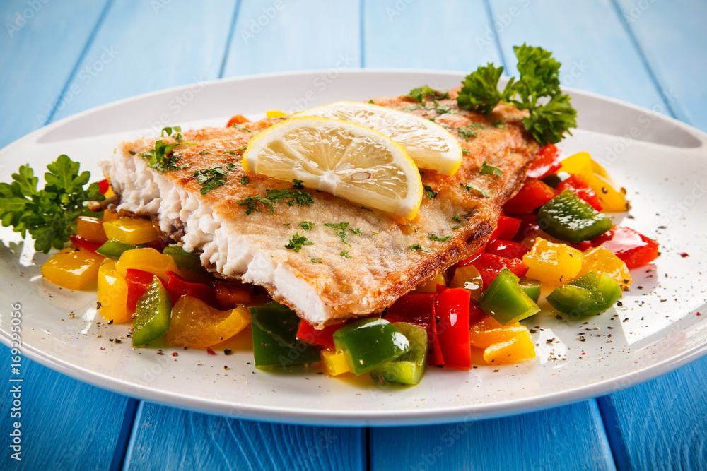 Fish dish - fried fish fillet and vegetables Fish dish - fried fish fillet and vegetables