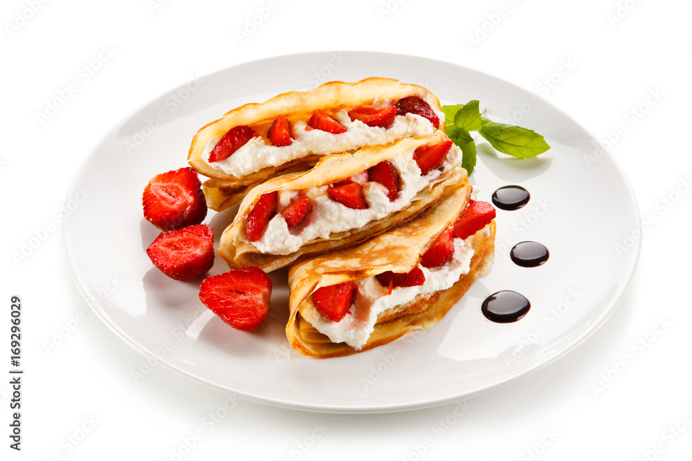 Pancakes with strawberries and creme Pancakes with strawberries and creme