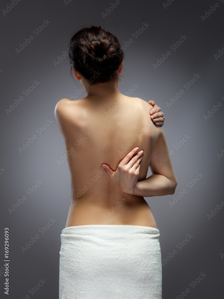 Woman massaging pain back