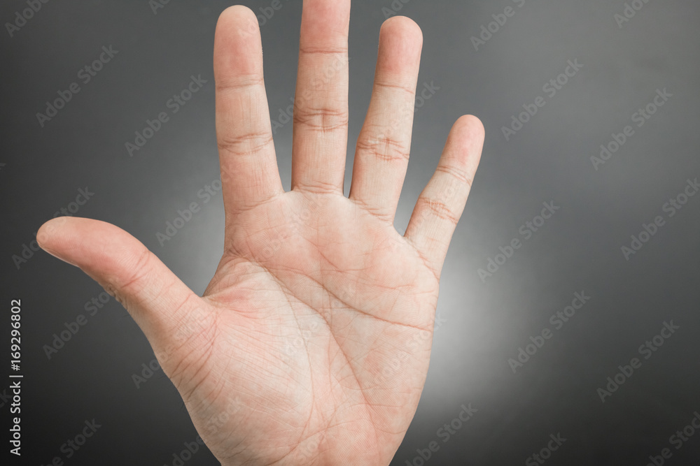Man hand showing the five fingers isolated Man hand showing the five fingers isolated