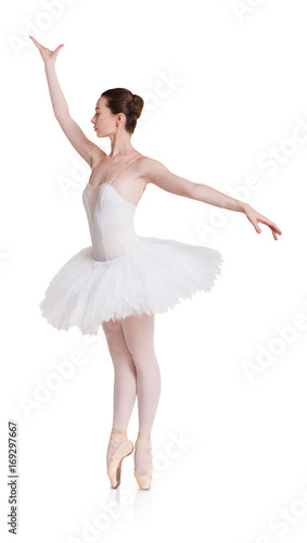Ballerina in ballet position on white isolated background