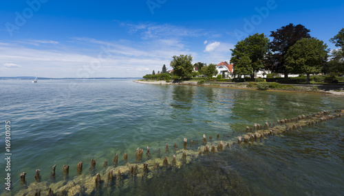 The wooden posts of the old landing stage in Hagnau at Lake Constance - Hagnau, Lake Constance, Baden-Wuerttemberg, Germany, Europe