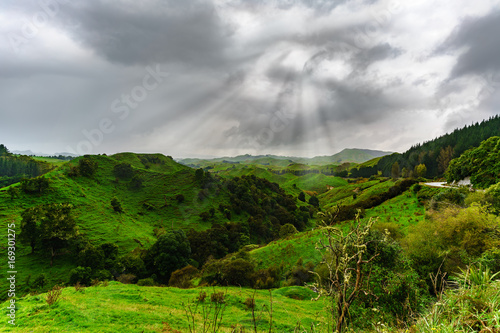 Beautiful scenery of mountains and sunrays along the way on Whanganui river road in National Park , Whanganui , North Island of New Zealand