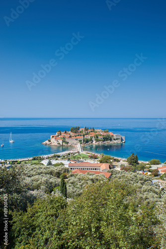 Fototapeta Naklejka Na Ścianę i Meble -  Sveti Stefan is a small island and luxury resort on the Adriatic coast of Montenegro, is located 6 kilometres south of Budva