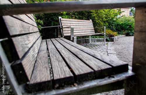 Two wooden benches in a park