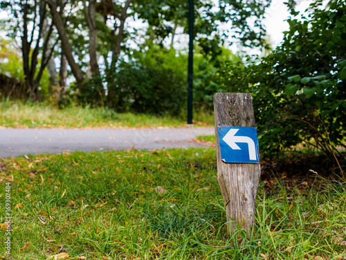 Turn left arrow sign on a stick