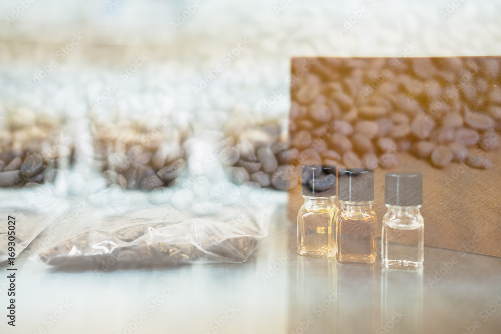 coffee tasting with reference flavor and roasted bean. aroma perception in coffee. bottle of fragrance for taster to smell aromatic. cupping examination coffee tasting with reference flavor and roasted bean. aroma perception in coffee. bottle of fragrance for taster to smell aromatic. cupping examination