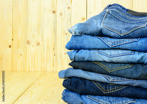 Jean denim on wooden table background.