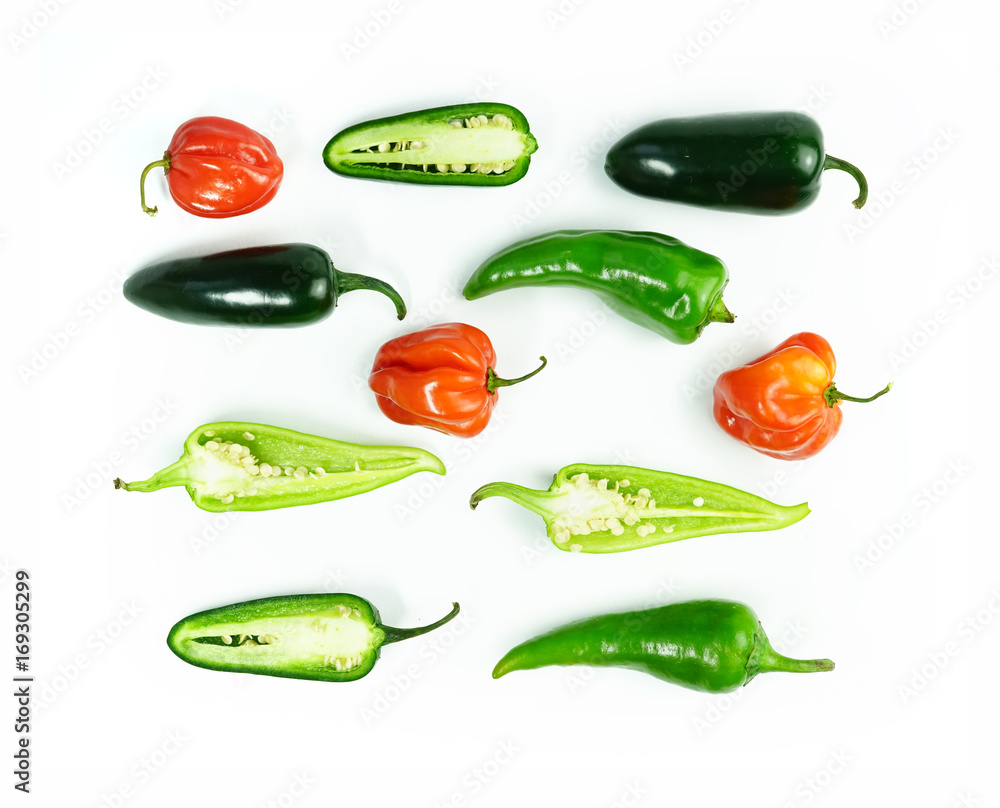 Multicolored set of red and green chili peppers Isolated on white background. Seamless pattern pepper chilli food concept. Creative layout vegetables abstract background. Multicolored set of red and green chili peppers Isolated on white background. Seamless pattern pepper chilli food concept. Creative layout vegetables abstract background.