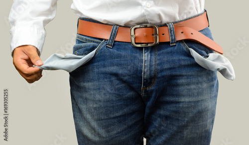 The businessman show his empty pocket.