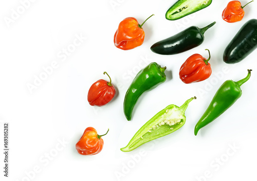 Multicolored set of red and green chili peppers Isolated on white background. Pepper chilli food concept. Creative layout vegetables abstract background.