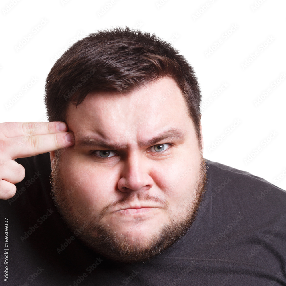 Obraz premium Angry man with fingers on temple, close up, isolated on white