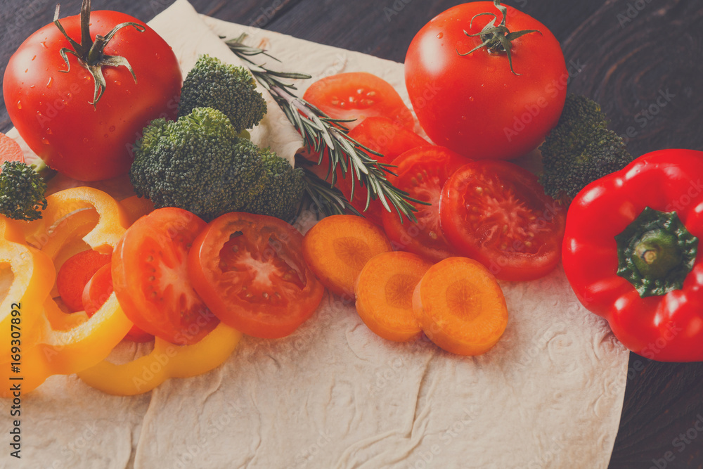Fresh vegetables on pita bread background. Fresh vegetables on pita bread background.