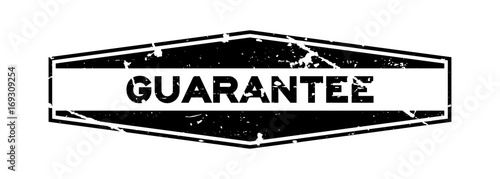 Grunge black guarantee hexagon rubber seal stamp on white background