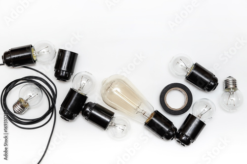 Retro light bulb, cartridges and wires for retro garlands on a white background isolated. Top view